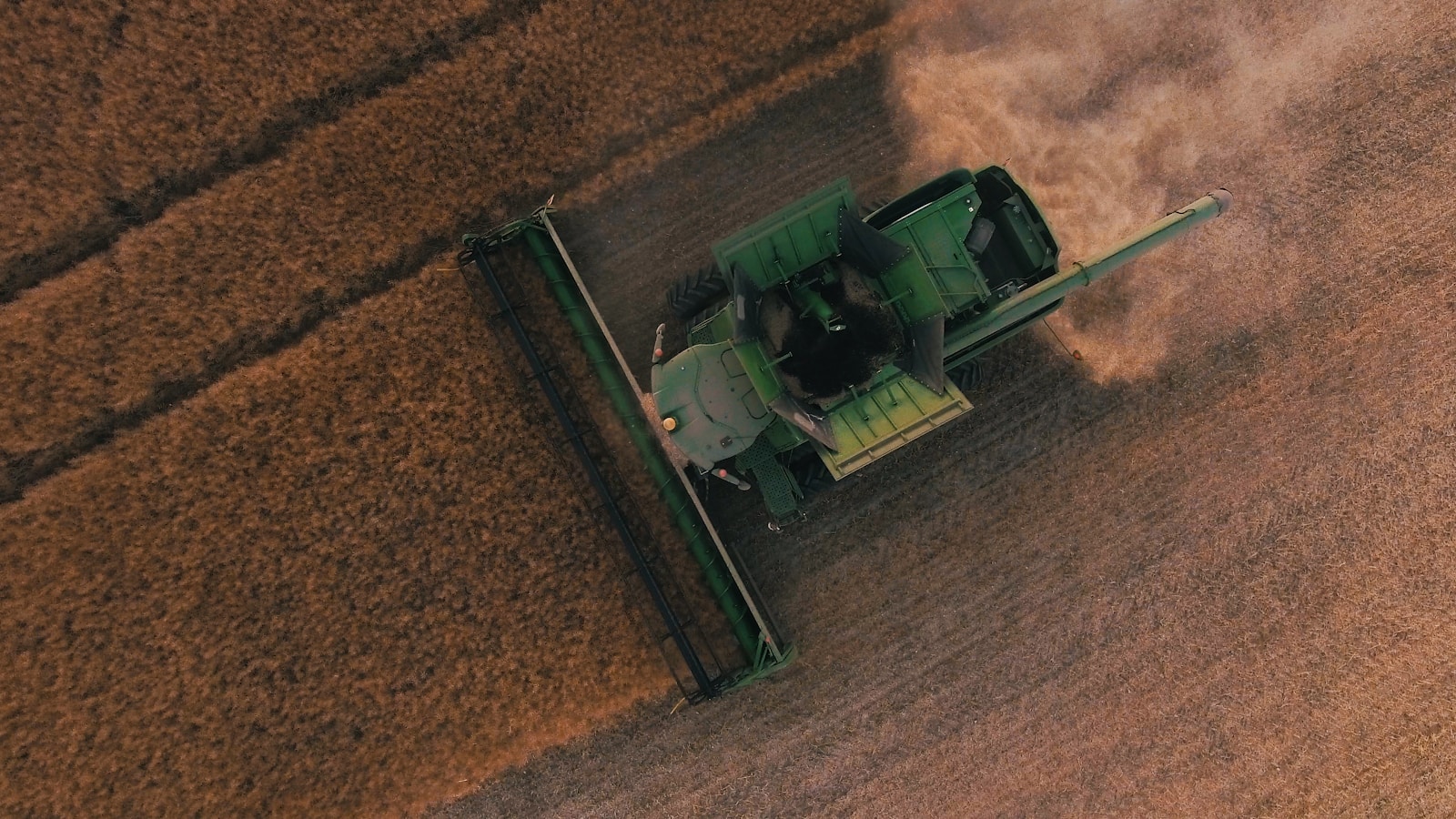 green farming equipment on brown field, farm